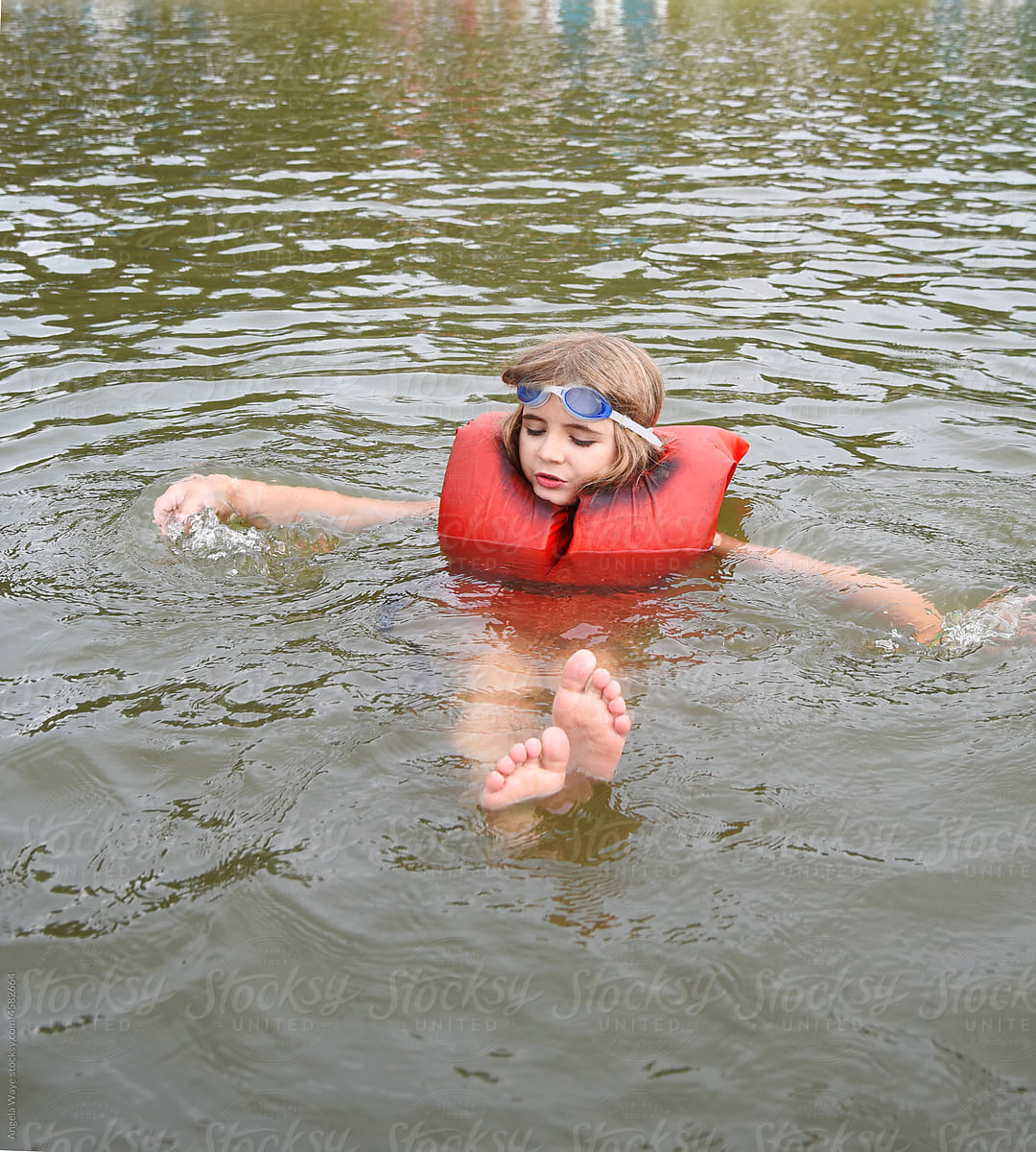 Child in Lake with Life jacket