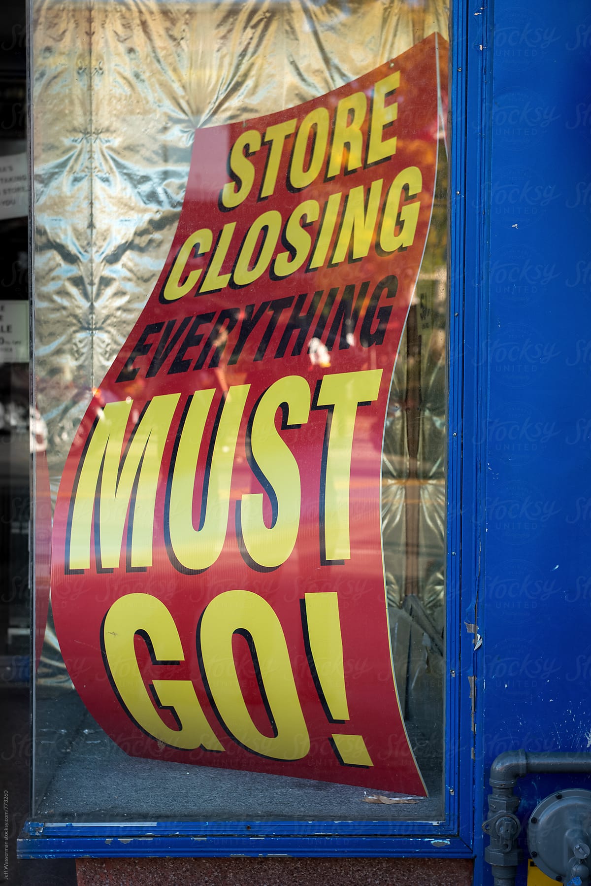 Store Closing Sign in Store Window