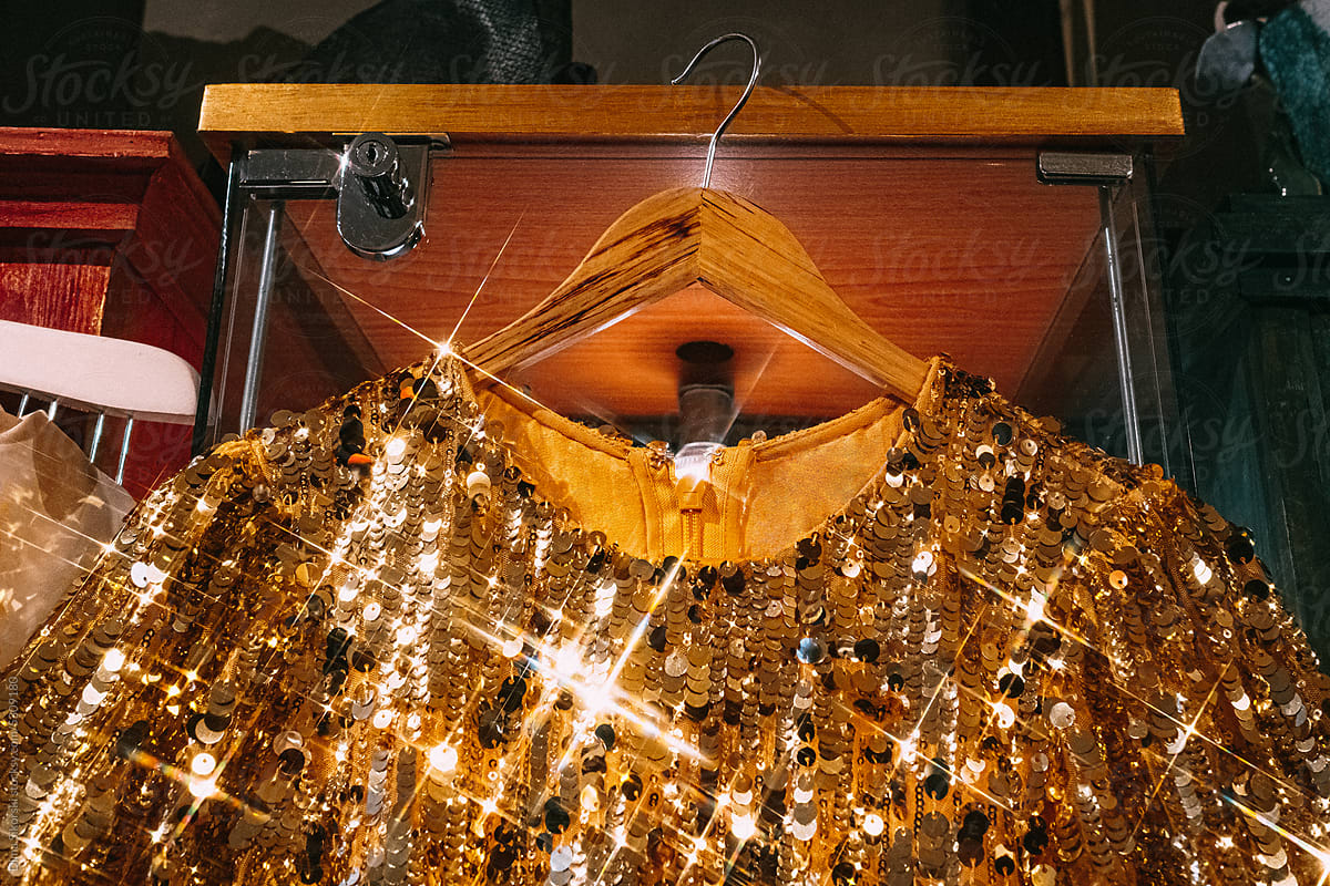 A beautiful dress with sequins glitters in a vintage second-hand store