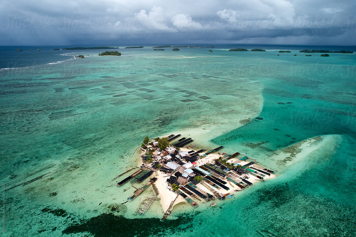 Climate change rising sea level, small flat heart shape Pacific island
