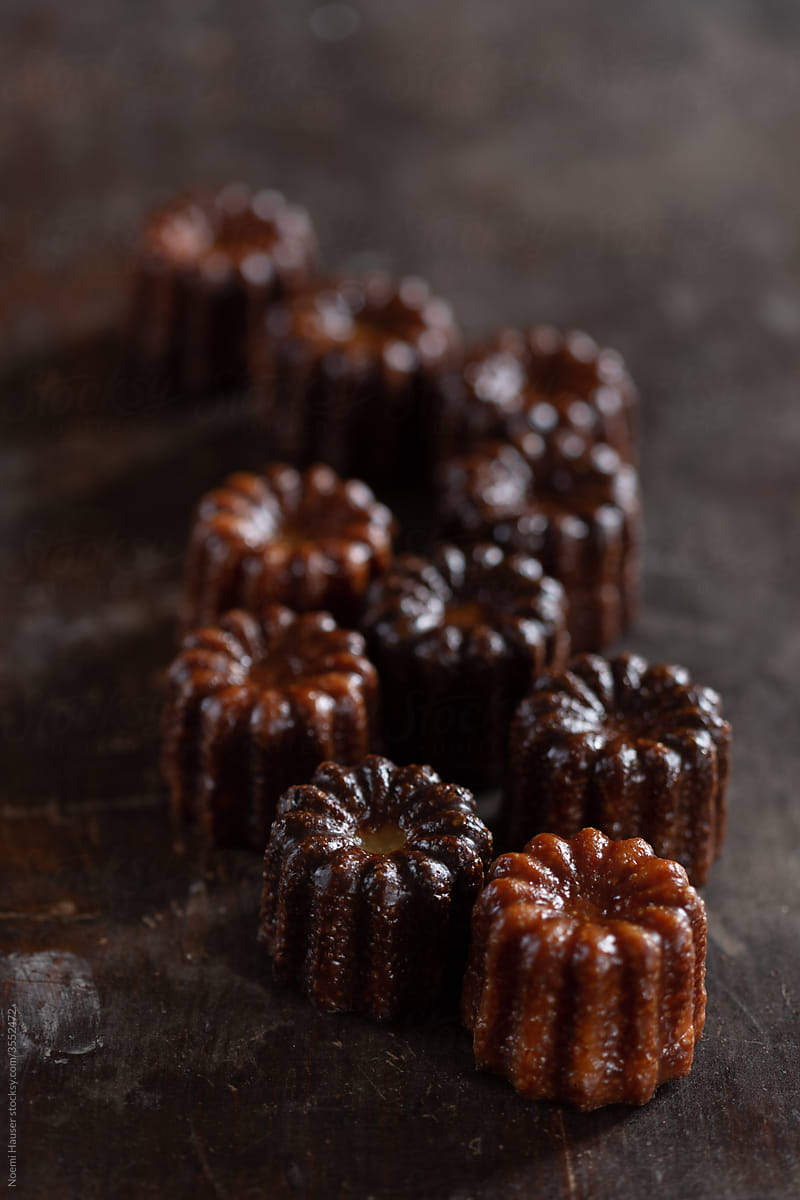 Canelé - French pastry on a grey plate