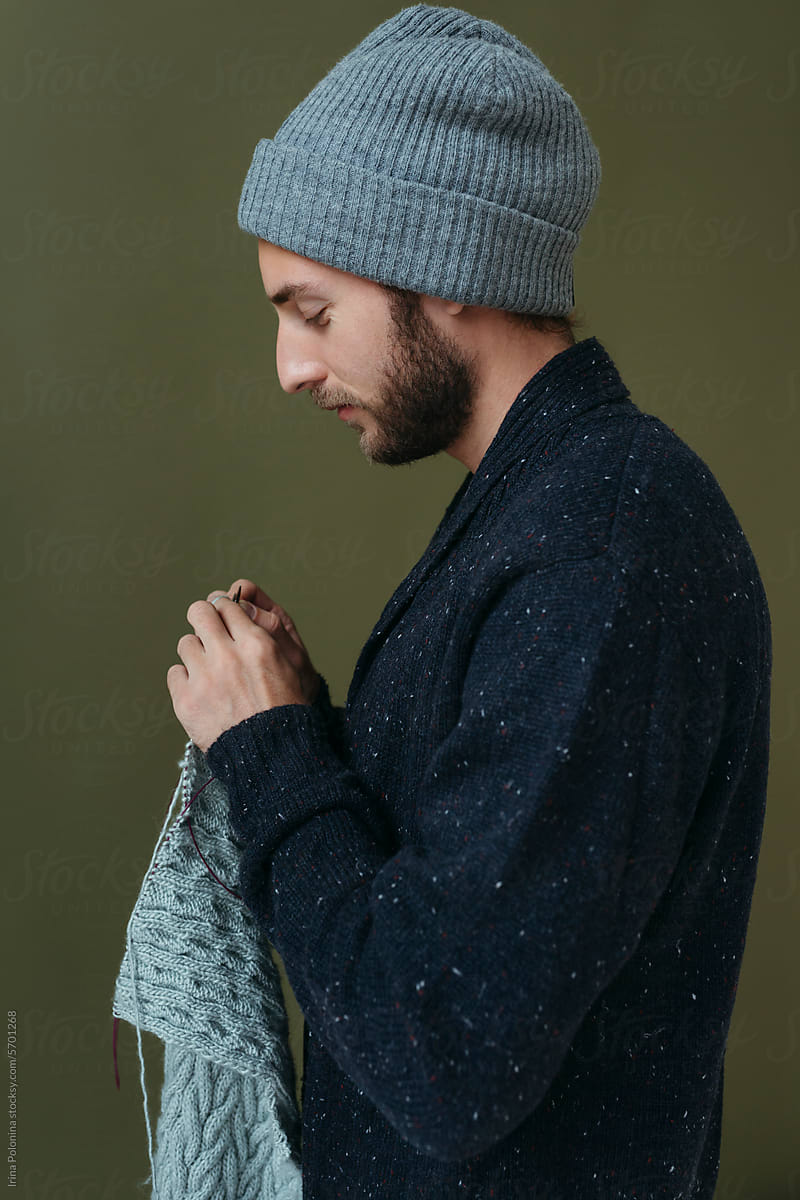 Portrait of knitting modern man.