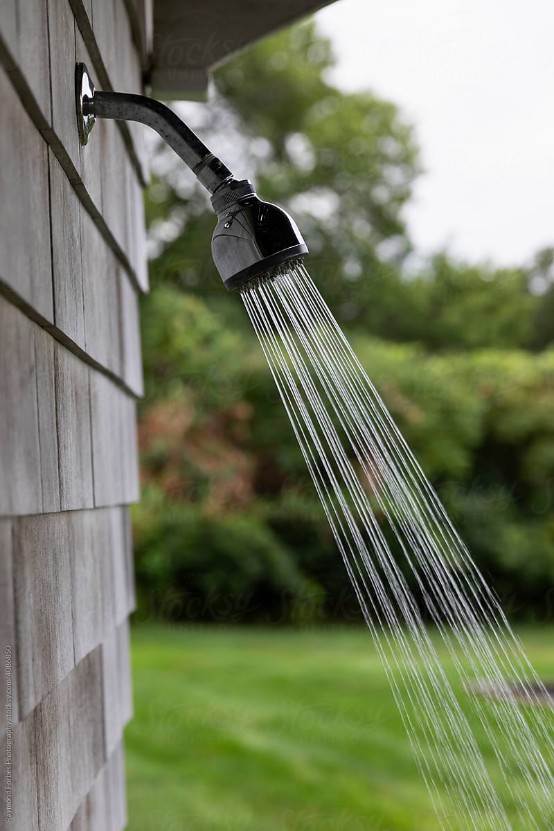 Outdoor shower with spray