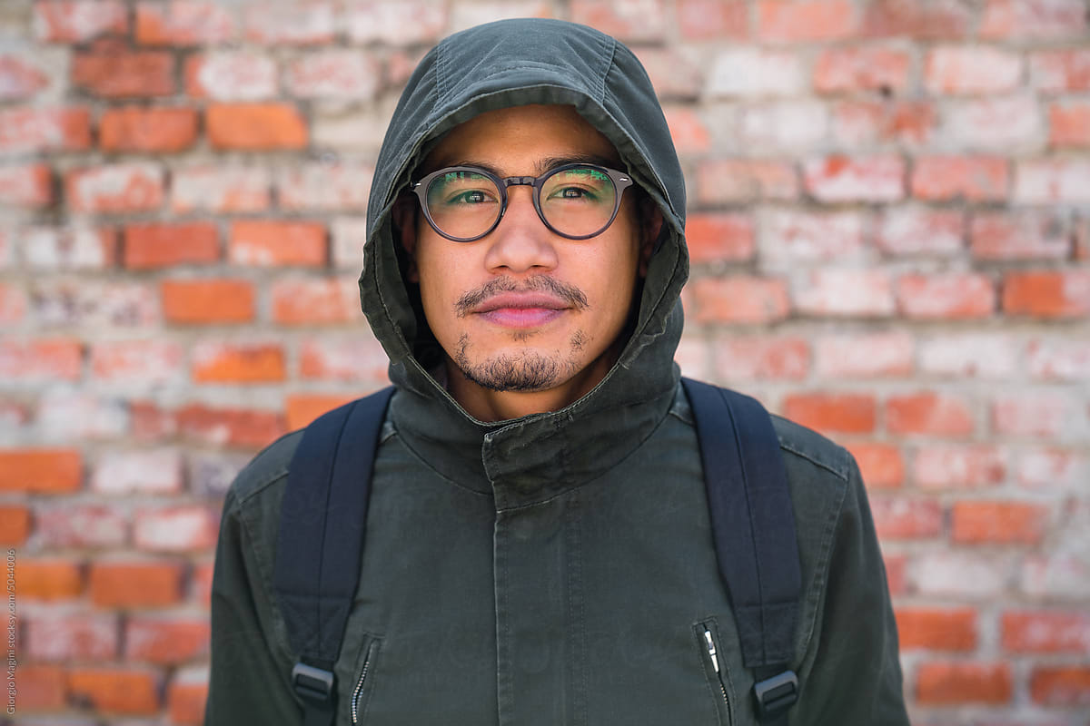 Portrait of a Filipino Young Man Wearing a Raincoat