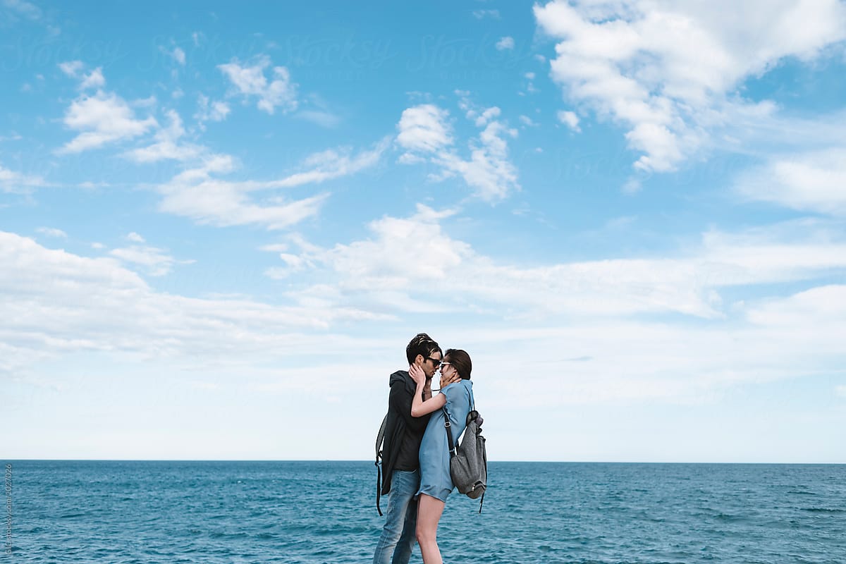 Couple Hugging Against The Sea By Stocksy Contributor Simone Wave Stocksy 
