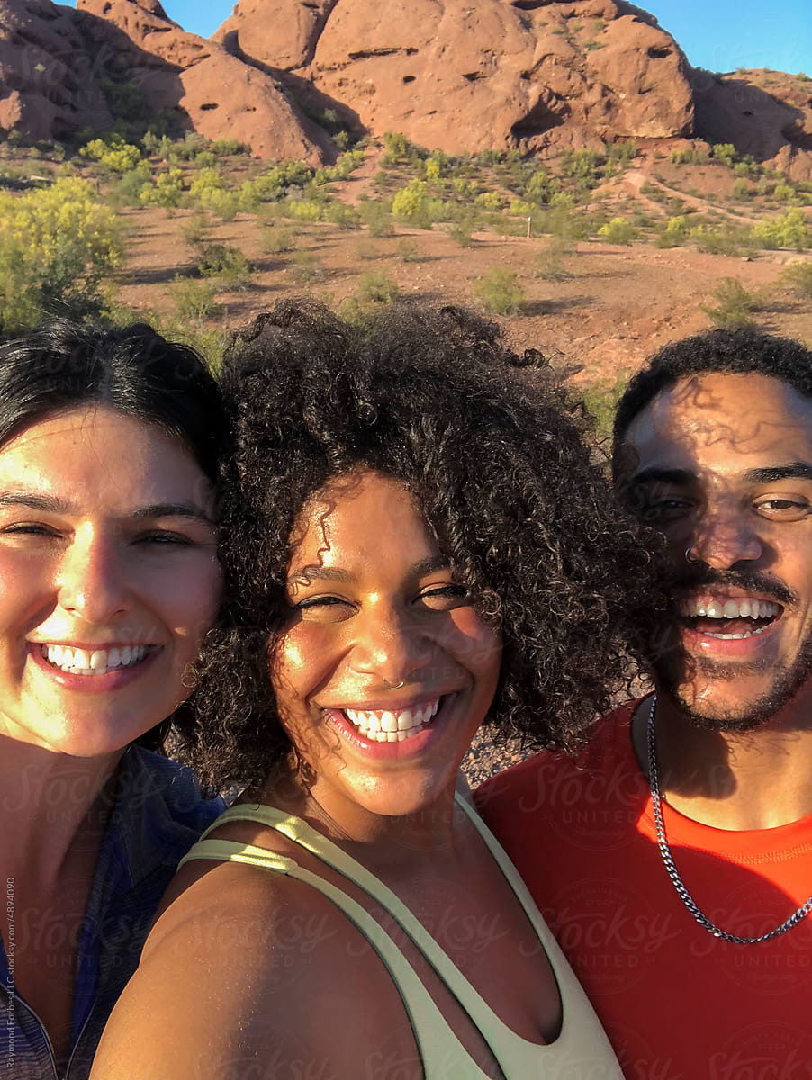 Friends Hiking together in Arizona vertical mobile phone selfie