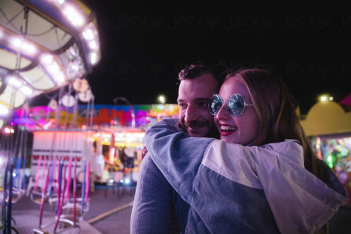 Smiling couple at the amusement park