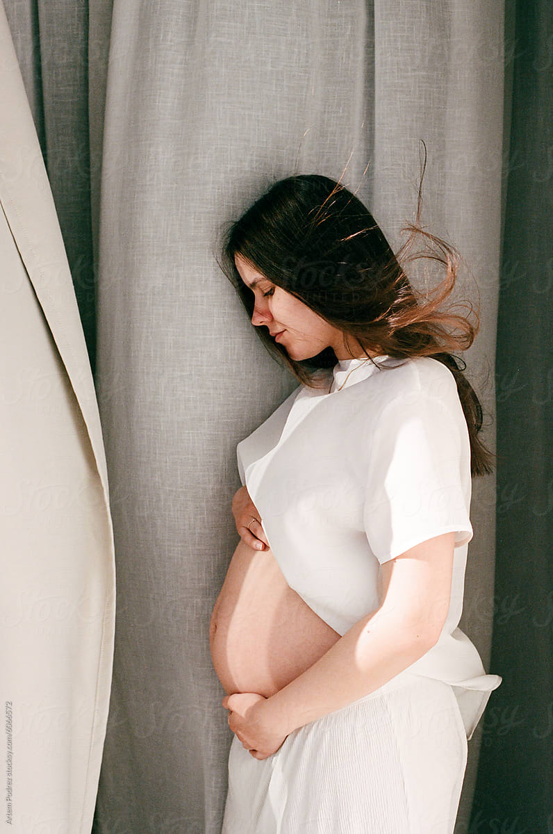 Film photo Pregnancy Woman portrait  in Soft Light