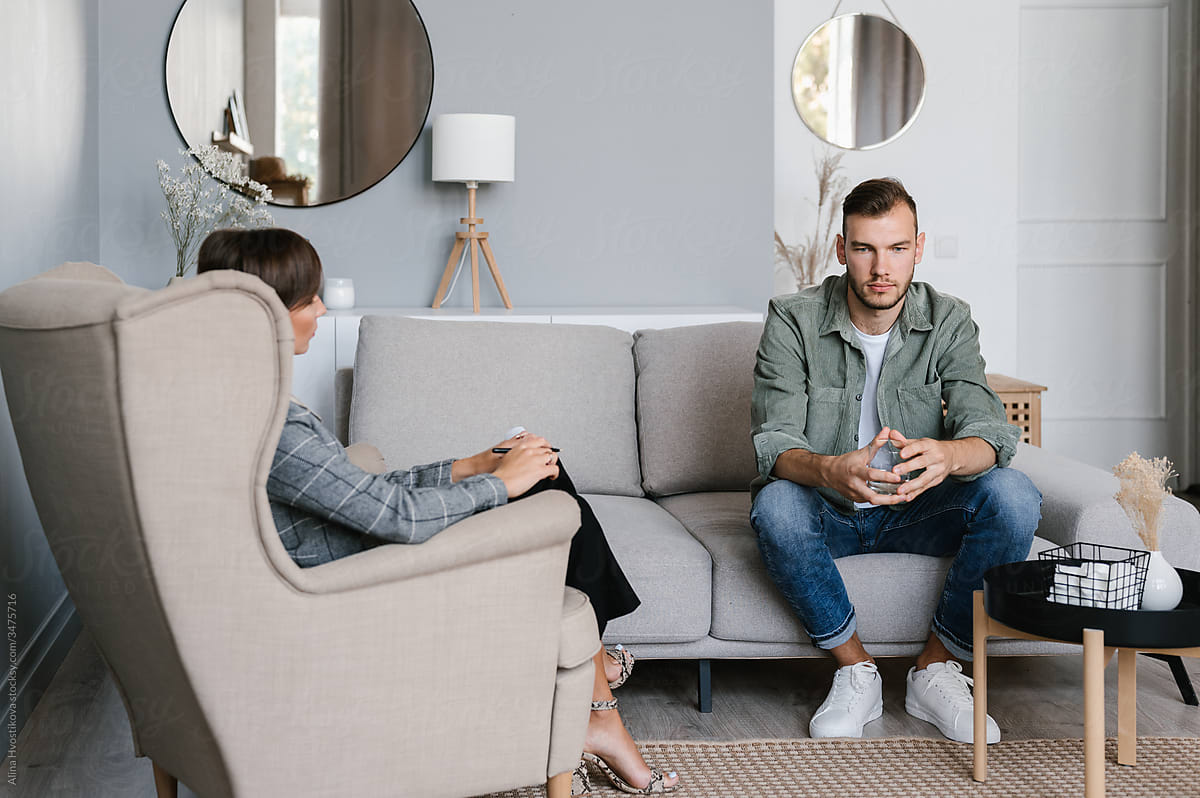 Man talking to psychologist during psychotherapy session