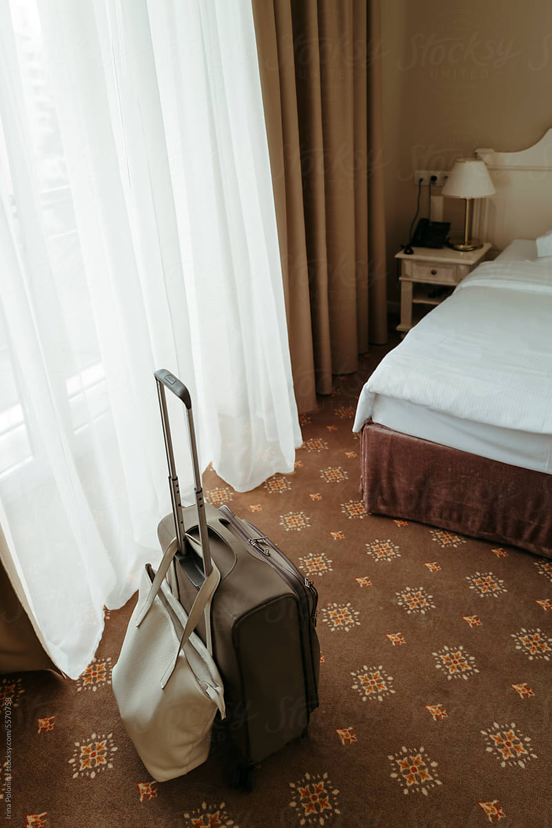 Travel luggage in hotel room.