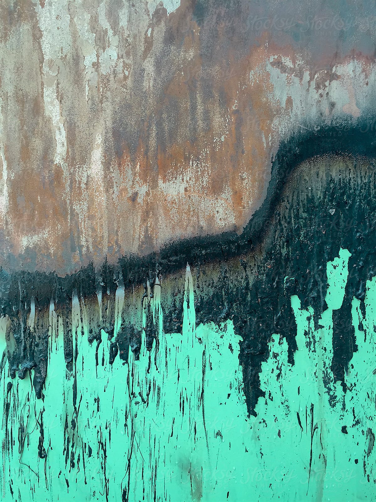 Close up of dripping toxic sludge on rusty, metal trash canister