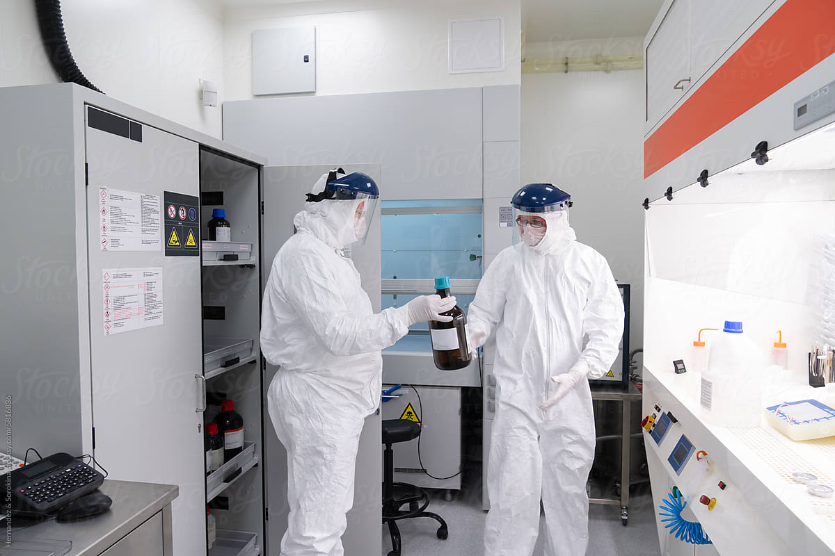 Two Researchers Working At Clean Room