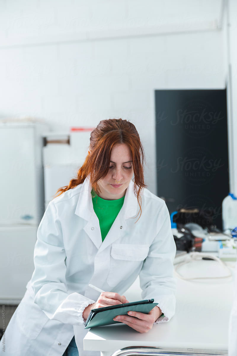Female scientist working in biotech laboratory