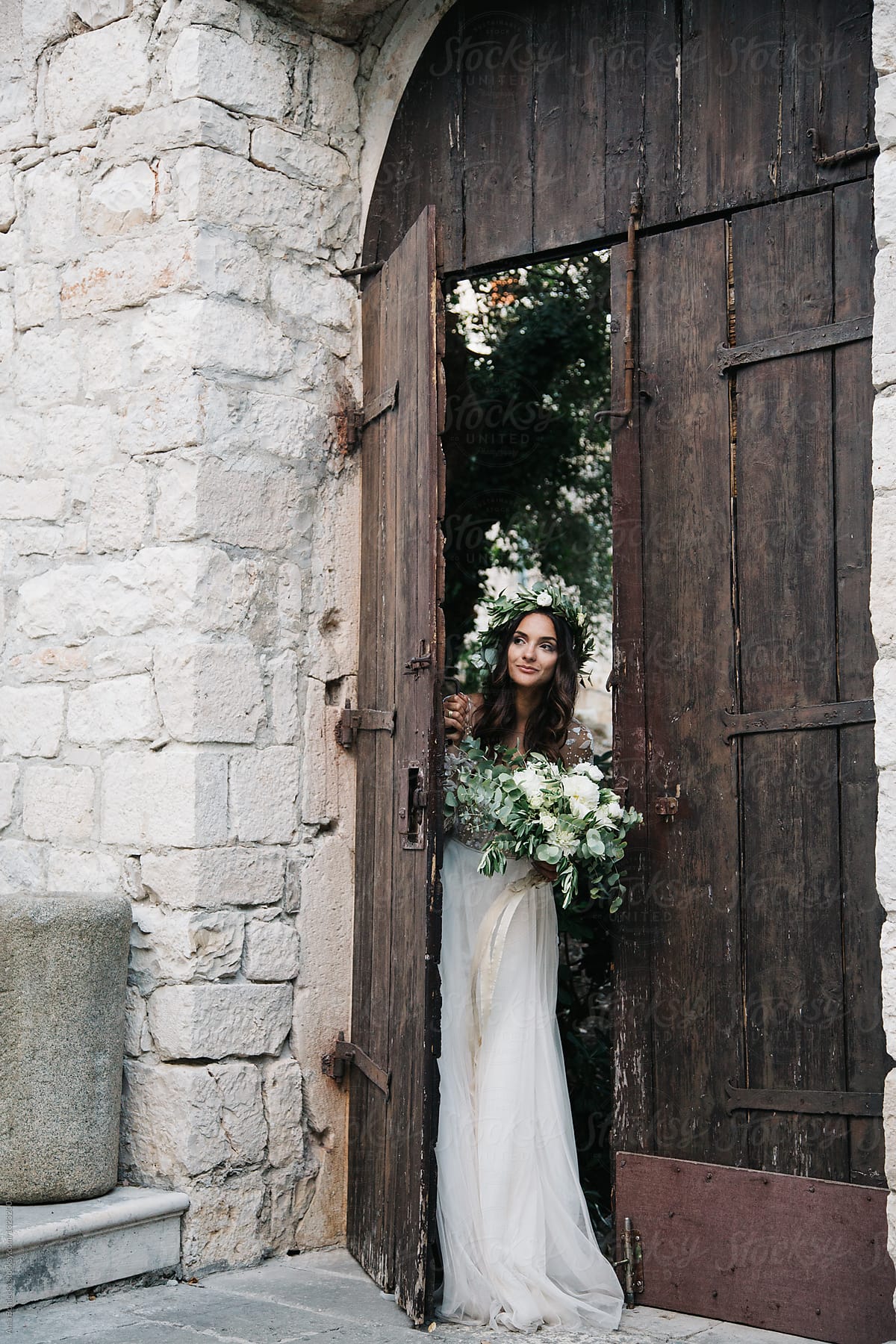Bride peaking through the door