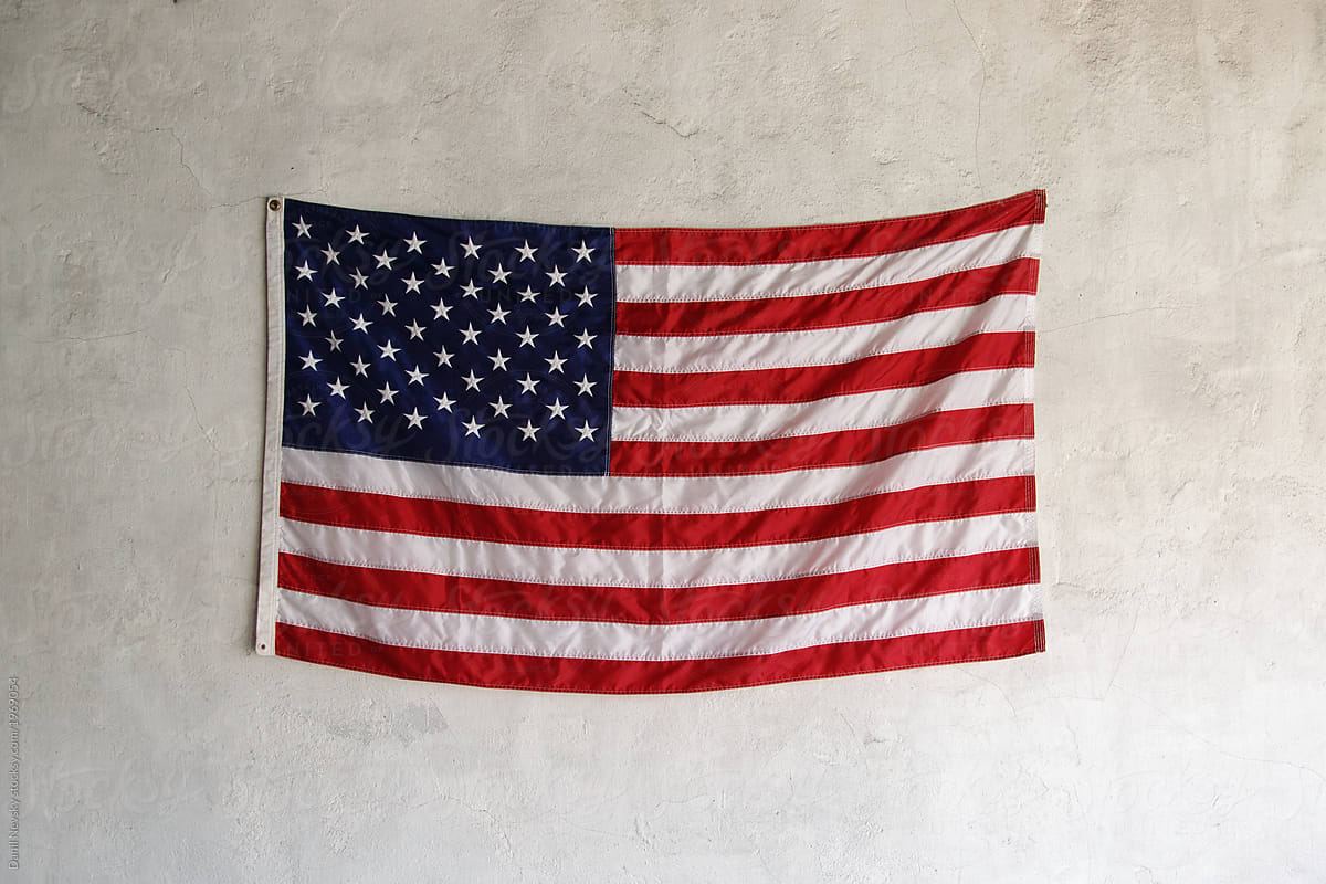 USA flag hanging on wall. Fourth of July by Danil Nevsky