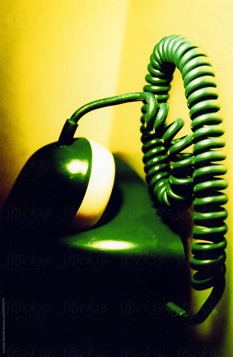 Elements of a retro telephone with the yellow background