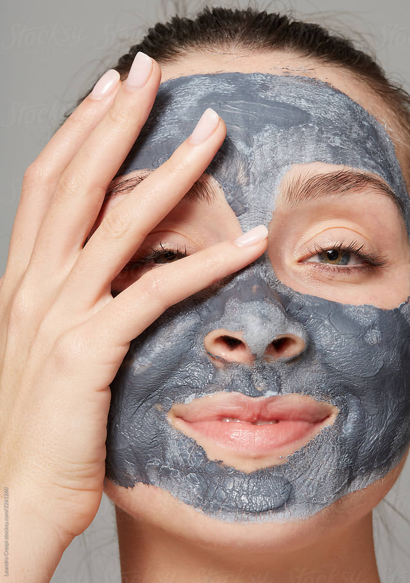 Editorial woman with clay mask