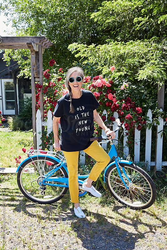 Portrait of stylish senior woman with bike