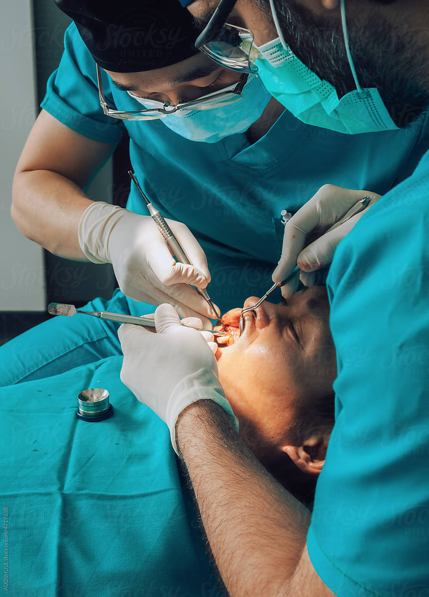 Putting implants during surgery in dental clinic