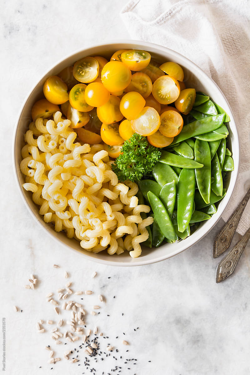 Simple snow pea, cherry tomatoes and pasta salad