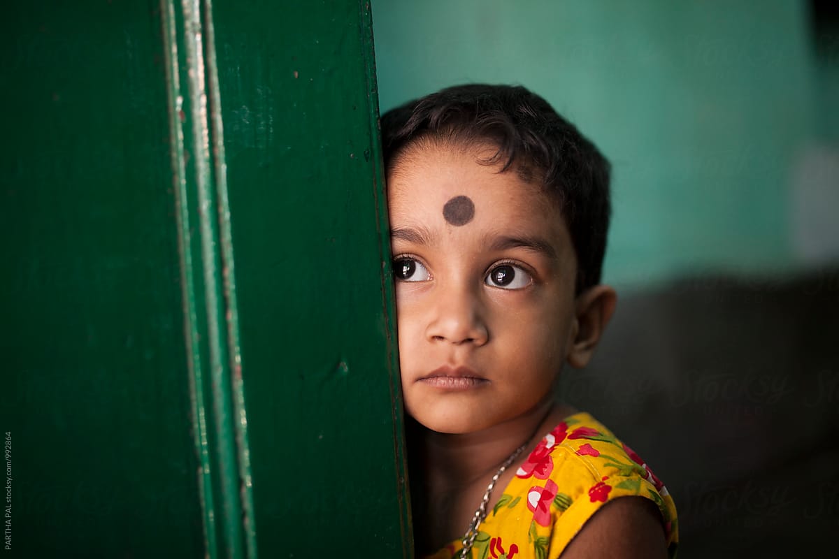 A Little Indian Girl Behind A Door By Stocksy Contributor Dream Lover Stocksy 