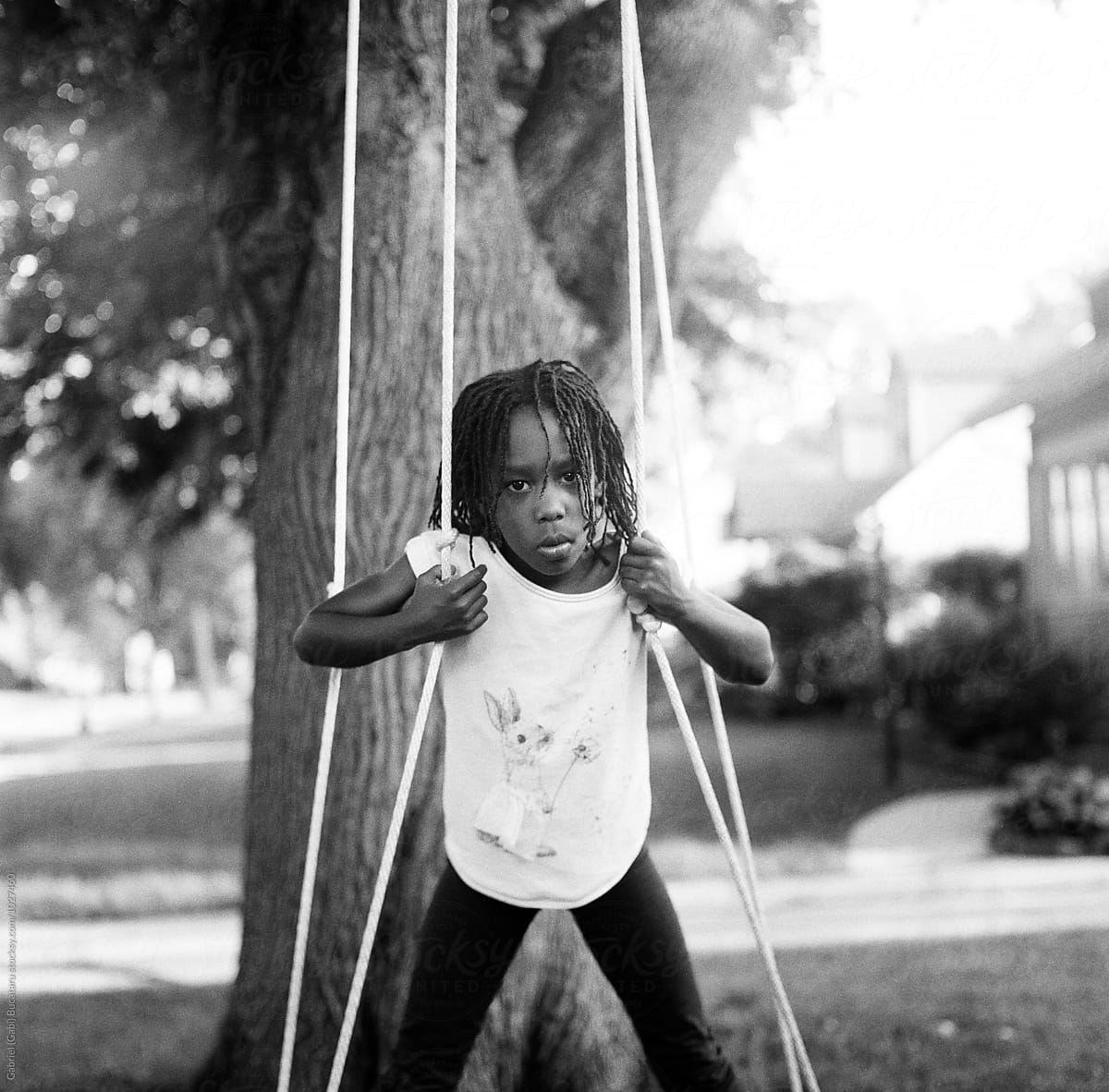 African American Girl On A Swing By Stocksy Contributor Gabi