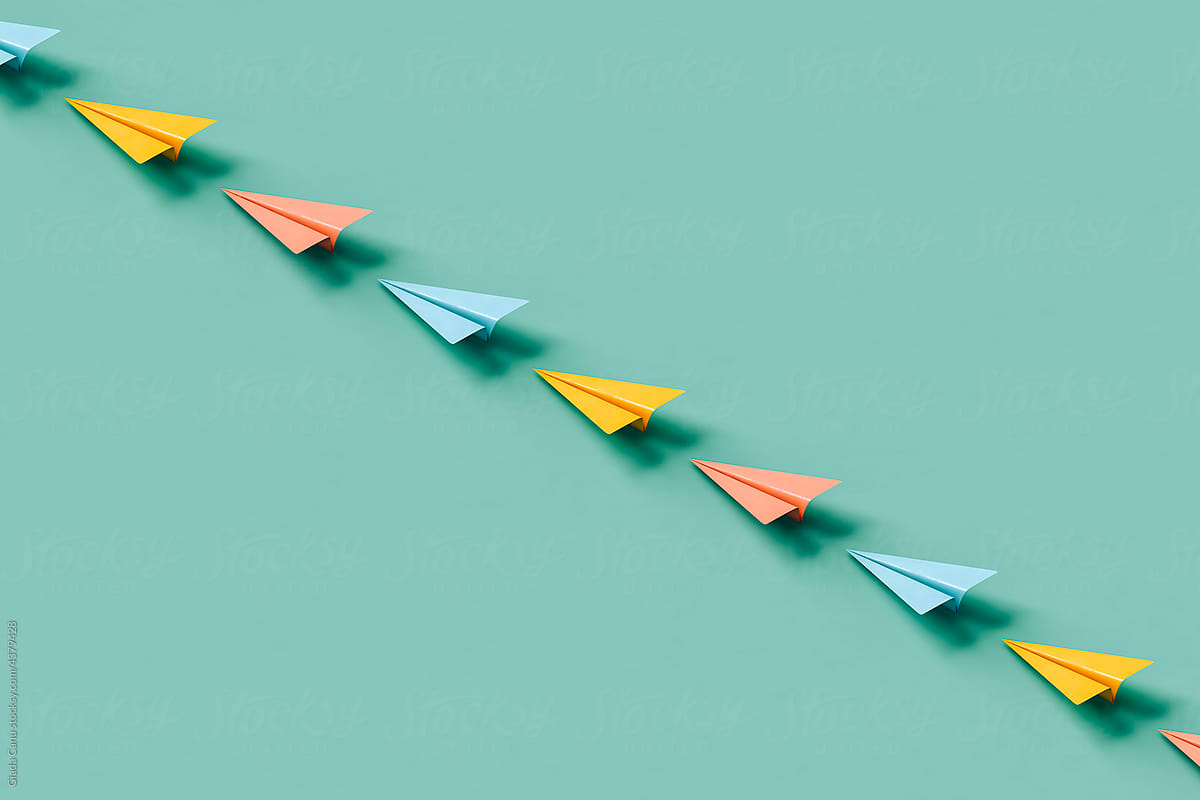 a row of paper planes on blue background