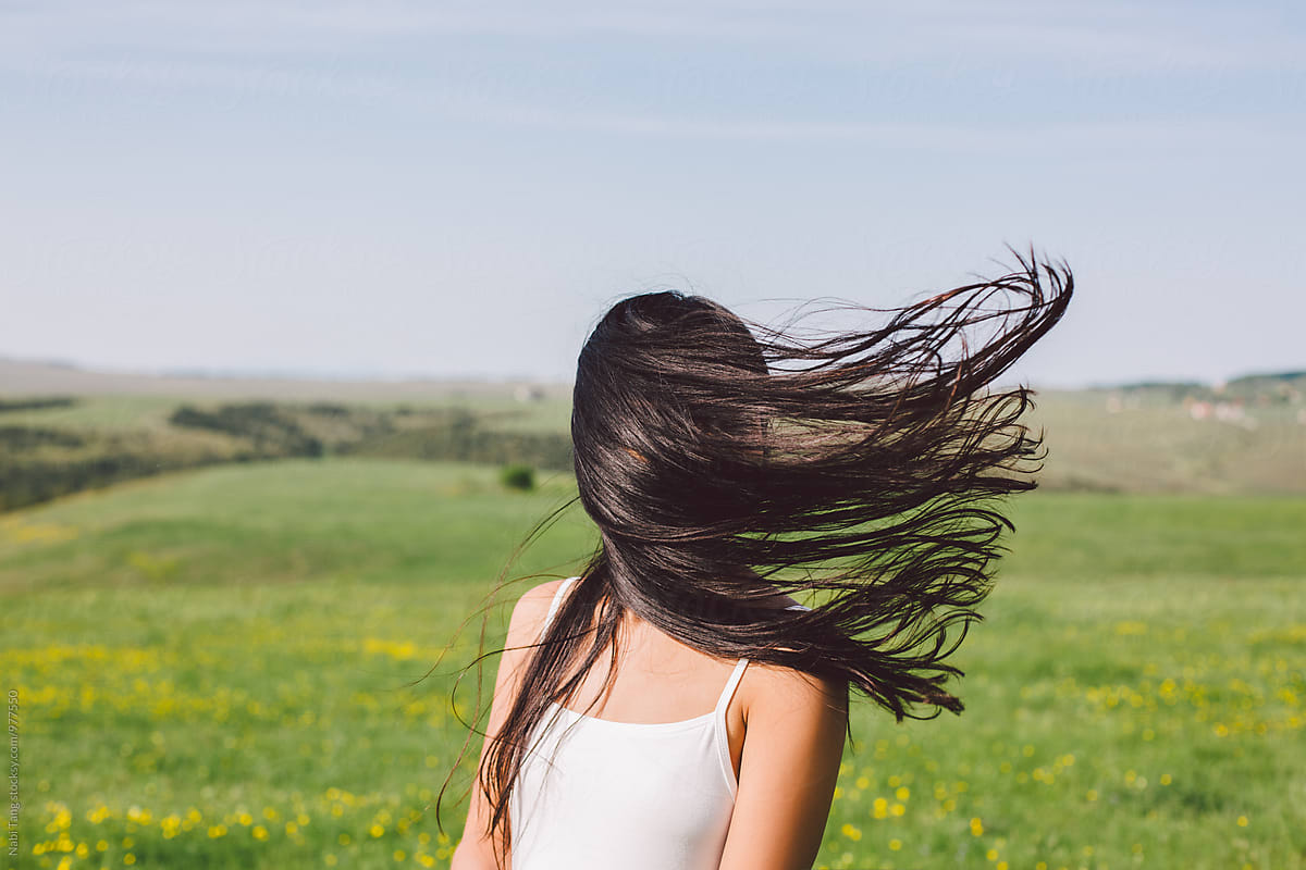 Woman Portrait When The Wind Blow Her Hair Covering Her Face By Stocksy Contributor Nabi Tang 