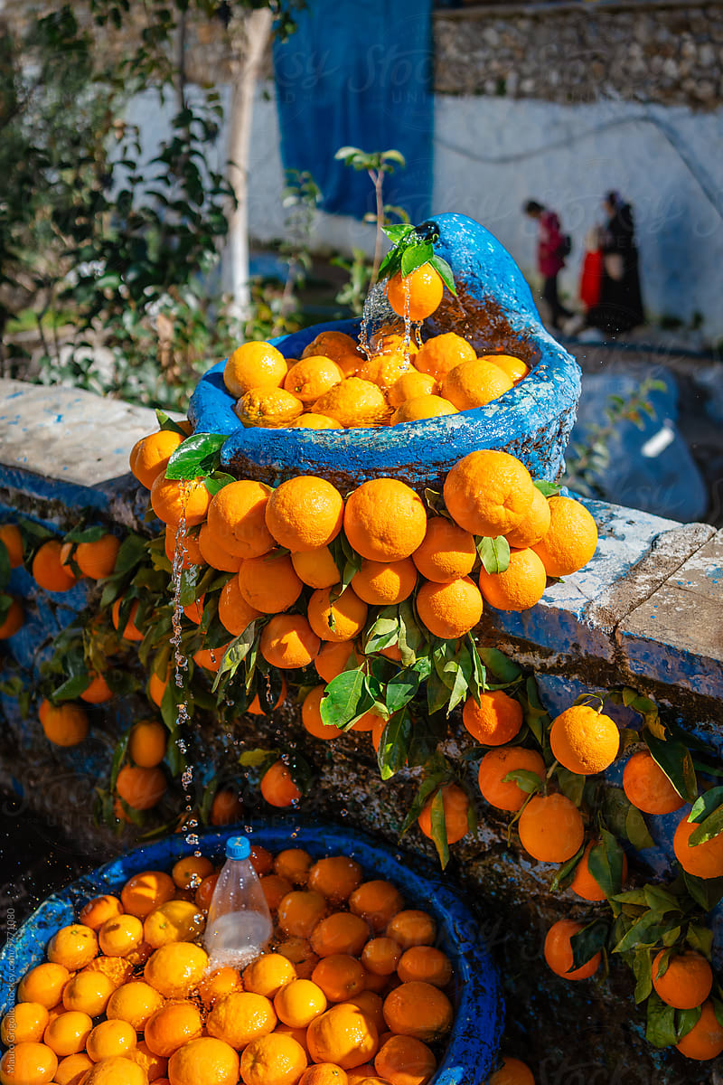 Oranges in a fountain on a street