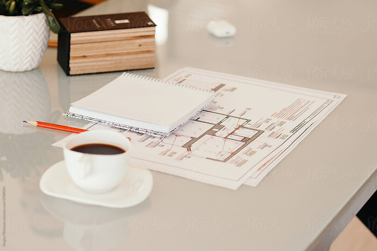 Coffee notebook and drafts on table