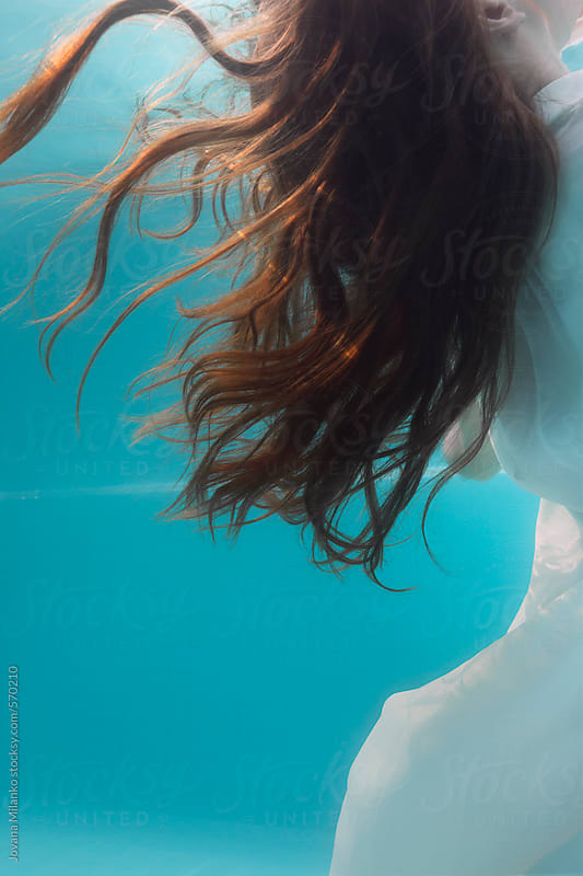 Woman's long hair floating freely underwater in the 