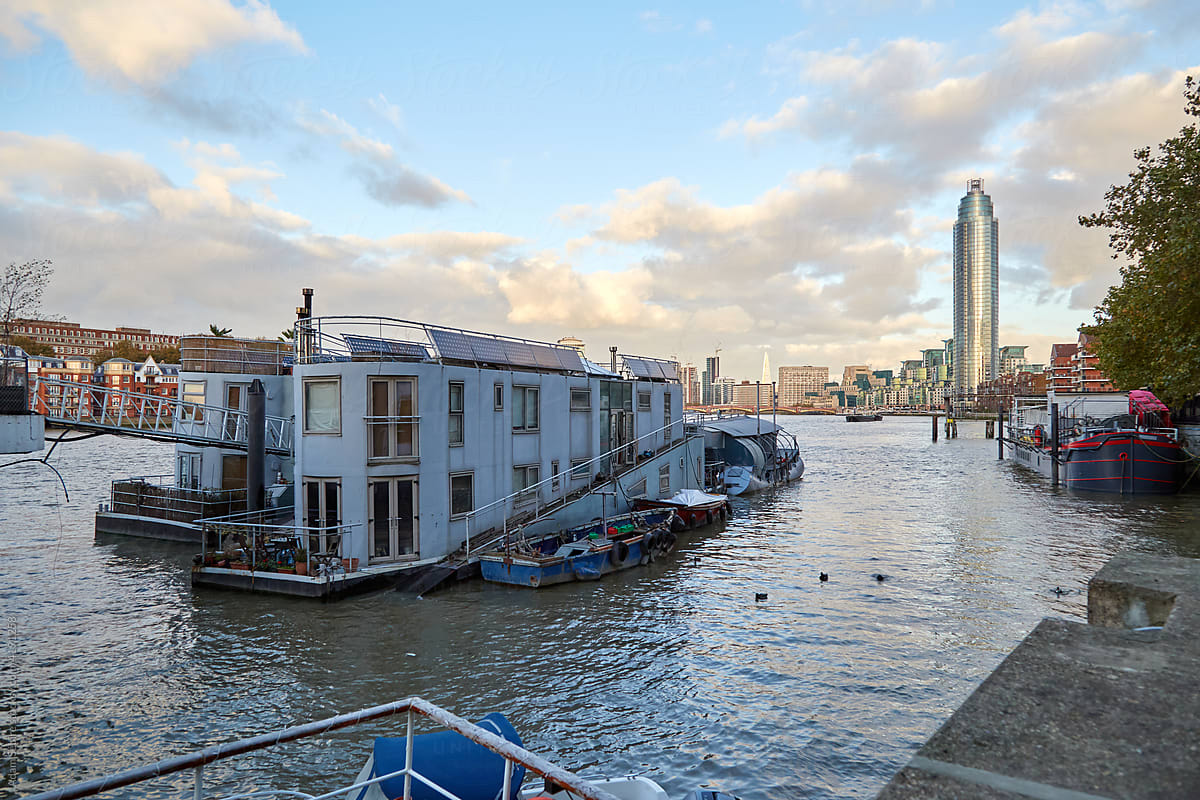 London Thames river high tide raises houseboats