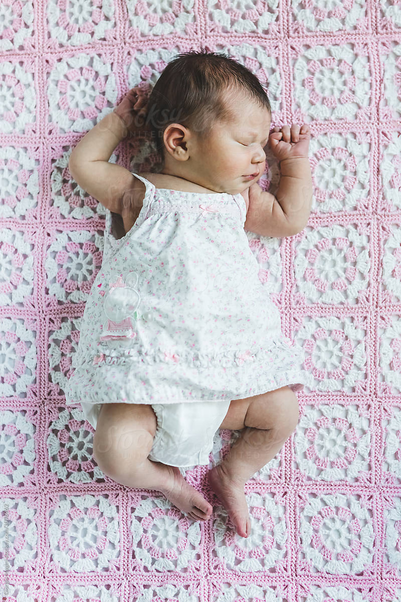 Newborn Baby Girl Sleeping on an Handmade Blanket
