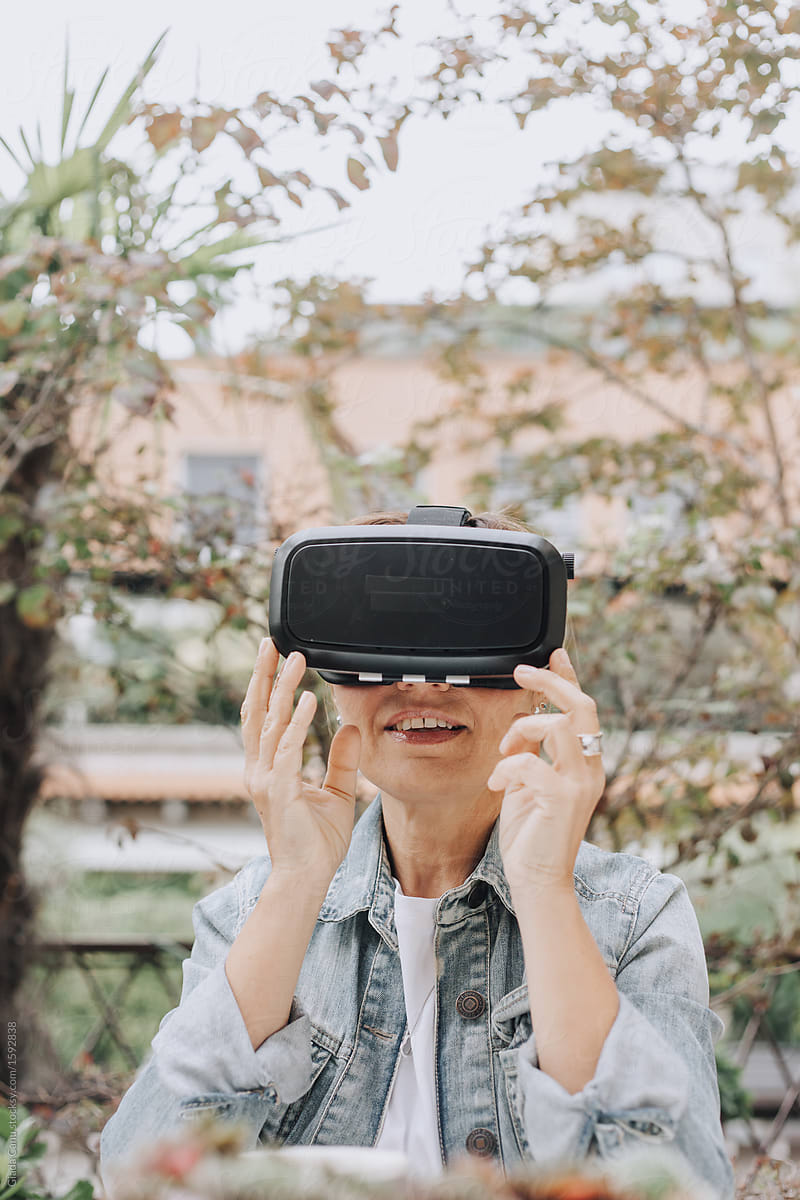 Woman smiling while using VR glasses