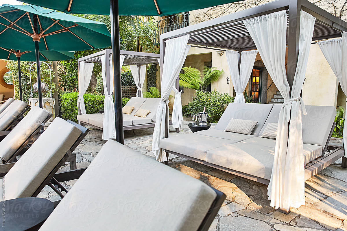 Cabanas on patio with champagne at luxury hotel