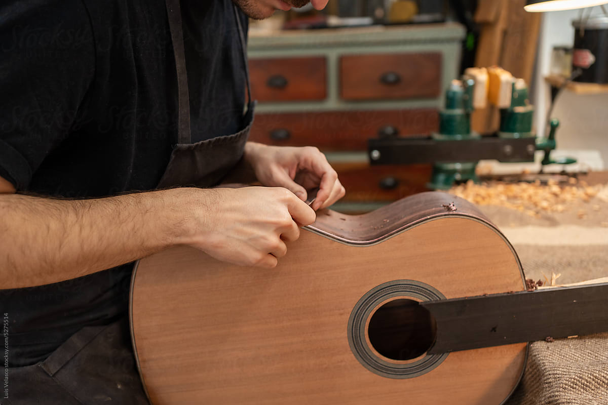 Luthier, Guitar Maker, Working In The Workshop.