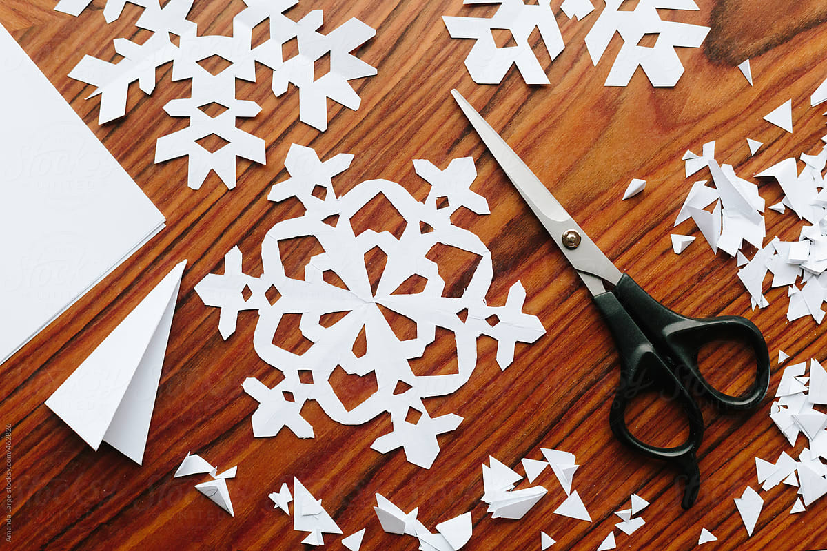 Making paper snowflake crafts.