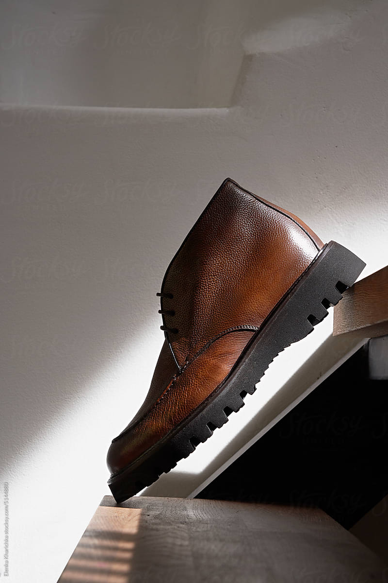Brown men\'s shoes on the stairs