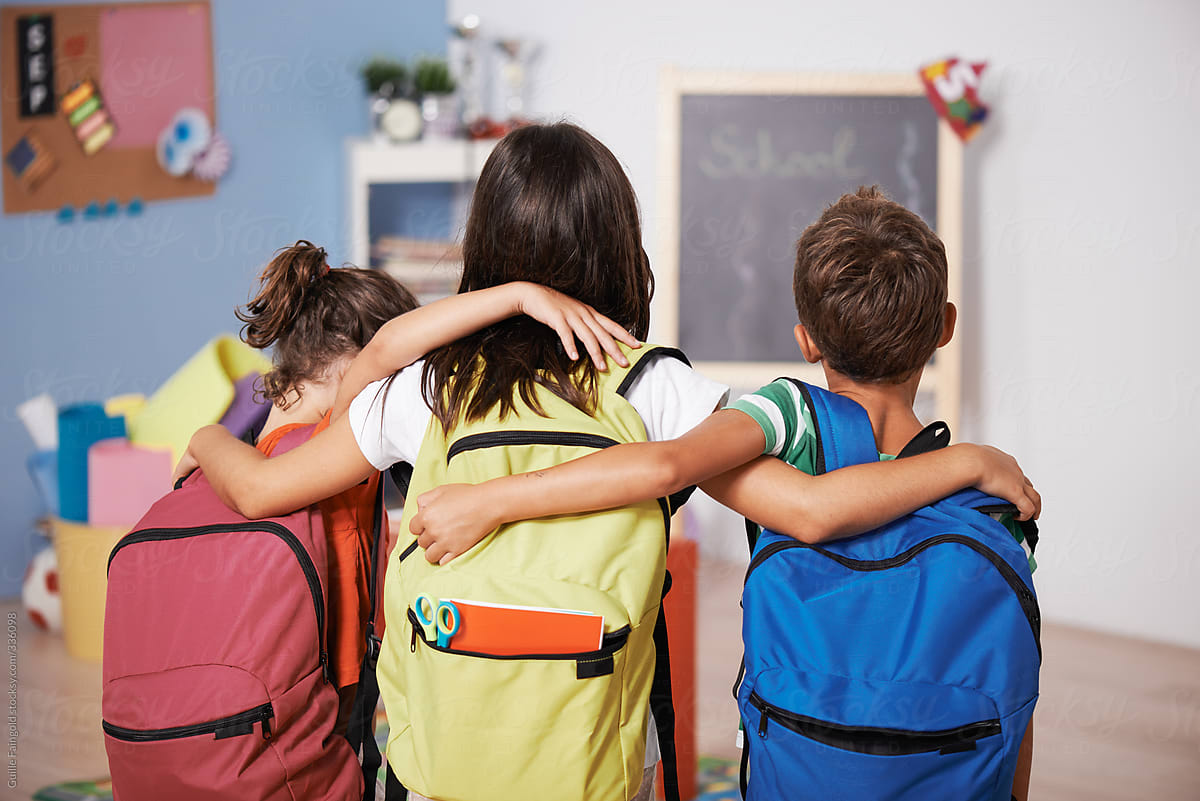 Pupils with backpacks back to school