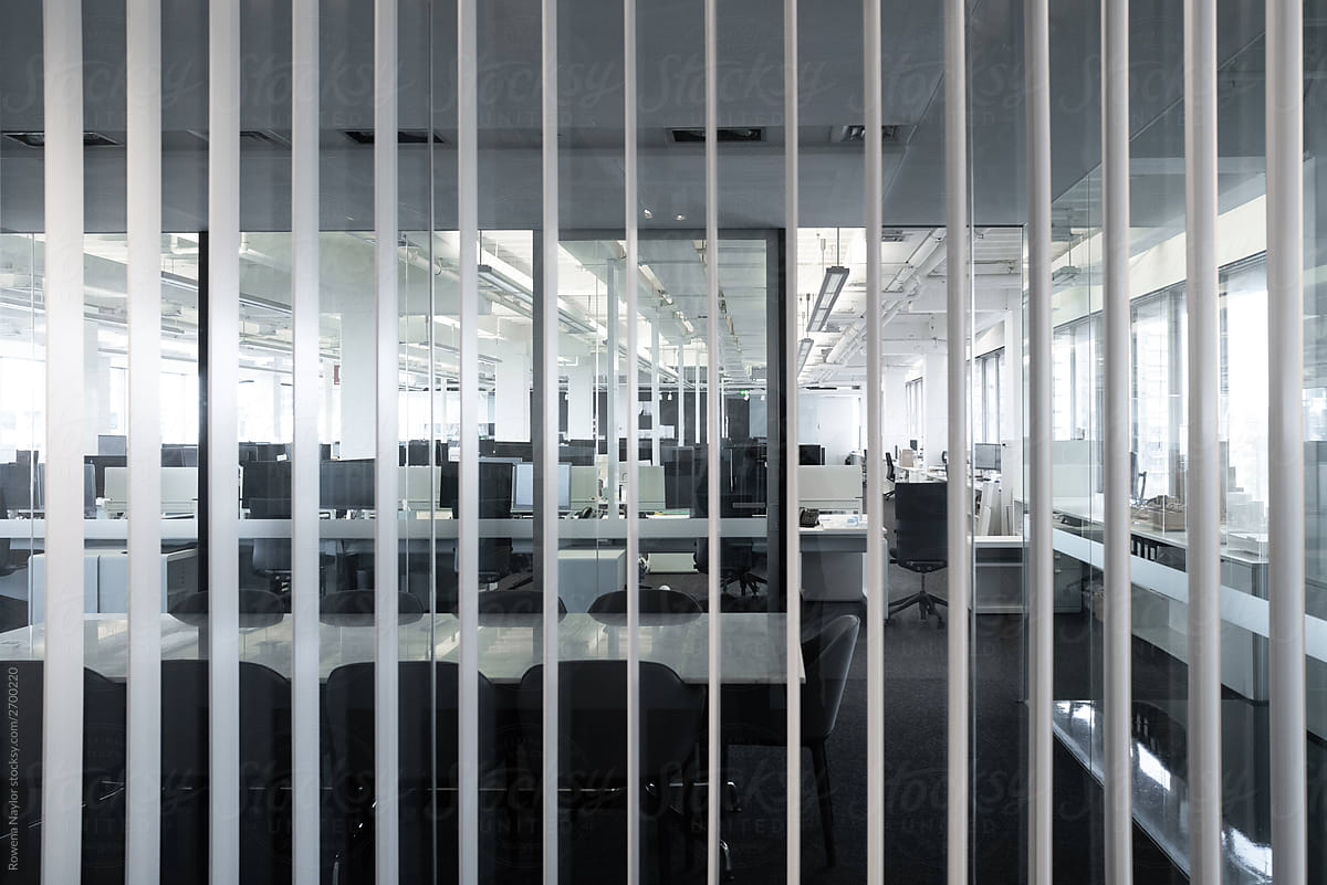 Open plan office behind vertical blinds