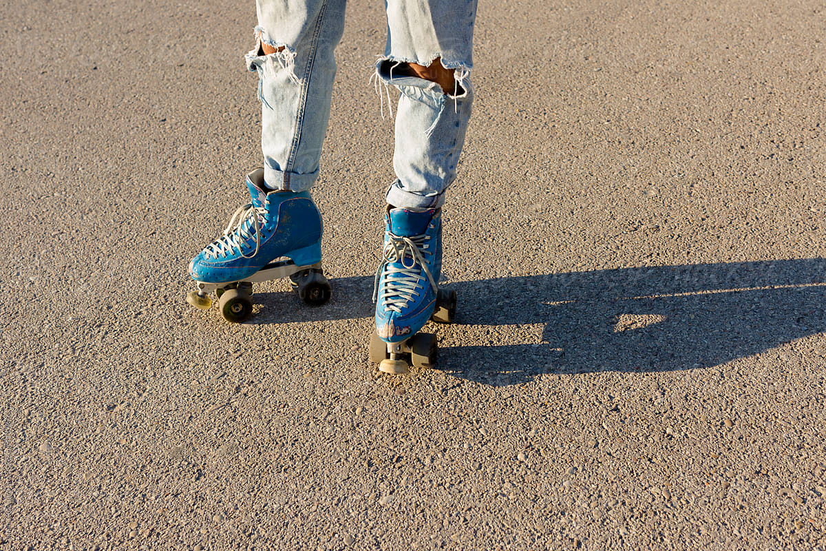 Grunge-style jeans and vintage roller skates