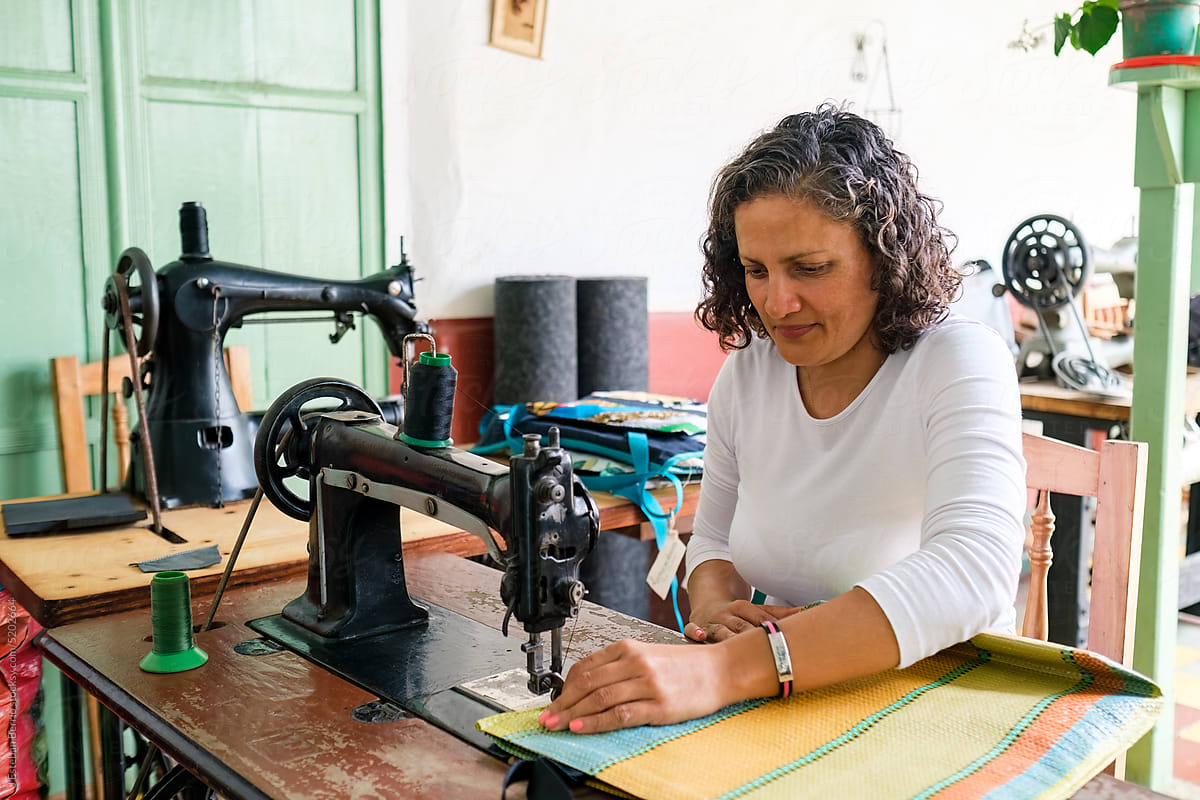 Latina woman at work in her garment workshop