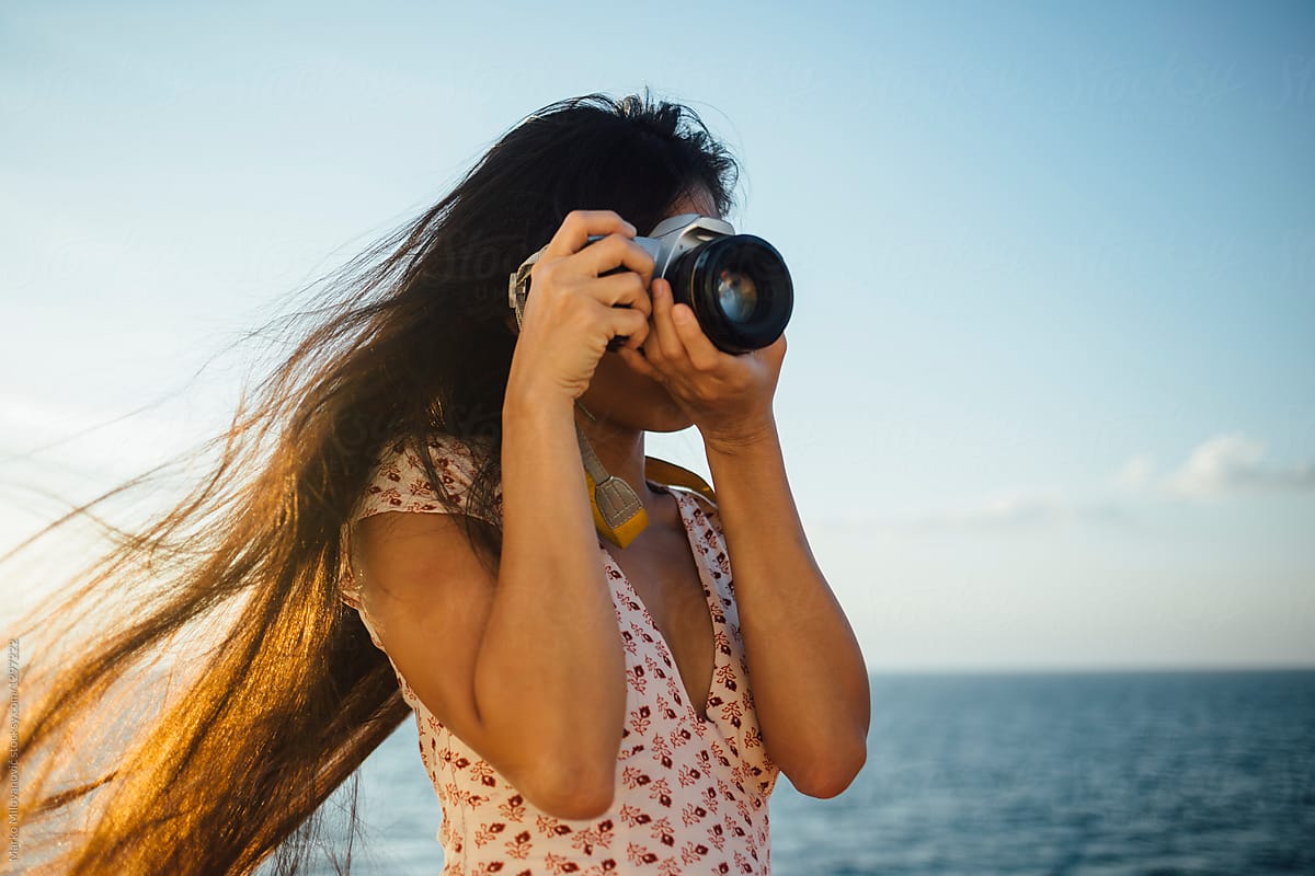 Female photographer on boat