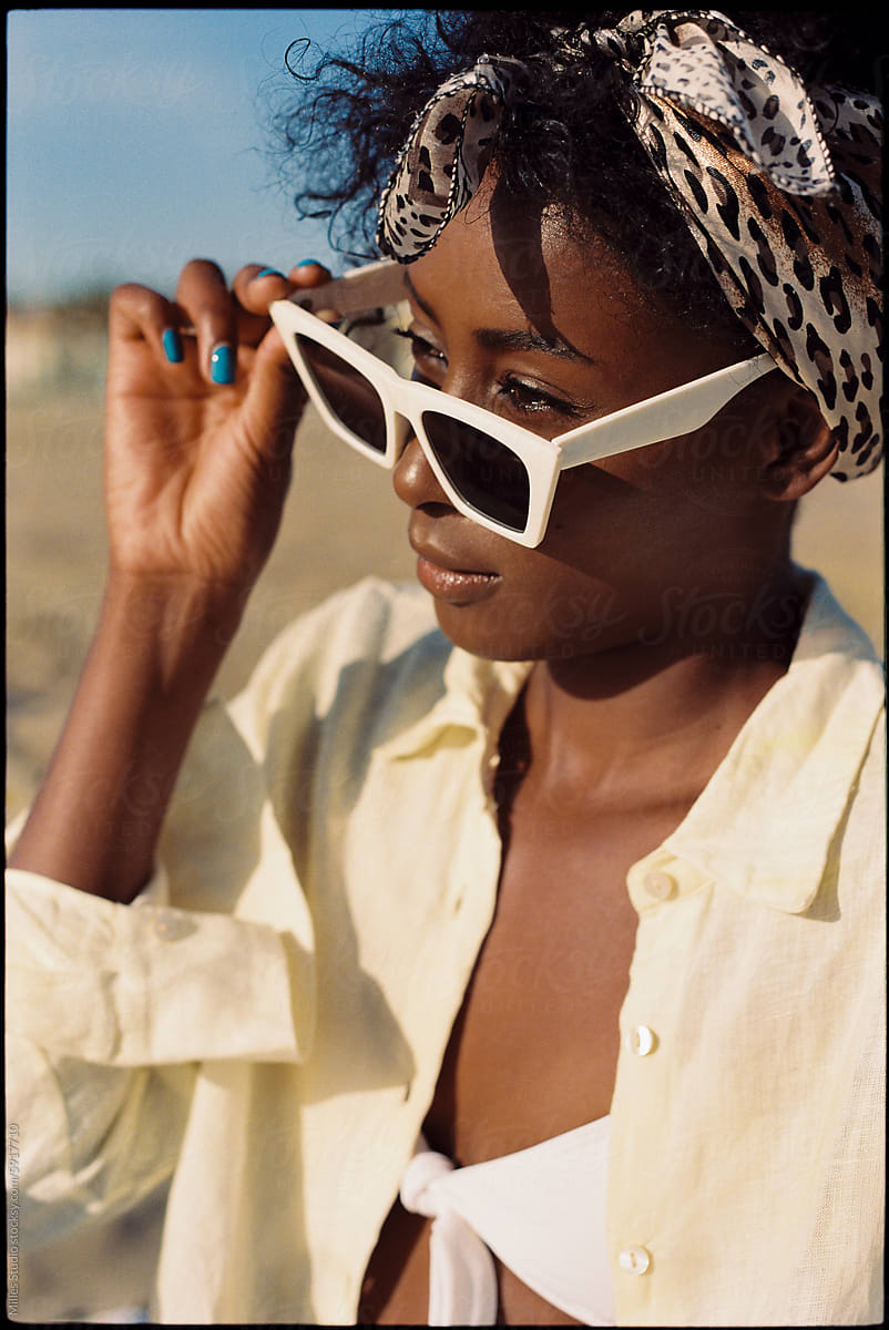 Portrait of beautiful black woman wearing sunglasses