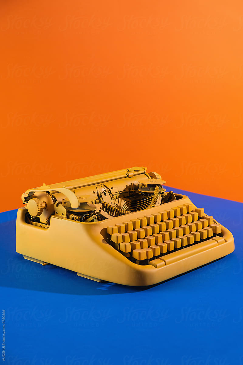 typing machine blue  orange background