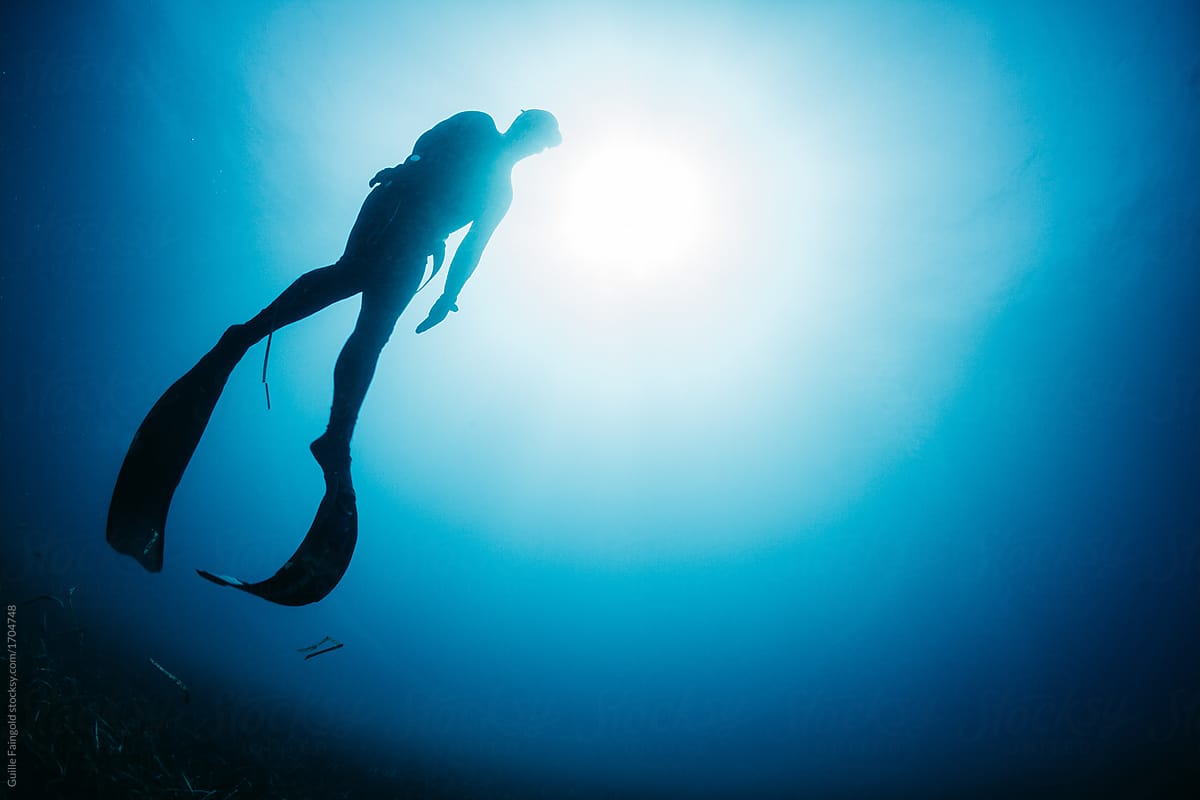 Freediver swimming in sea