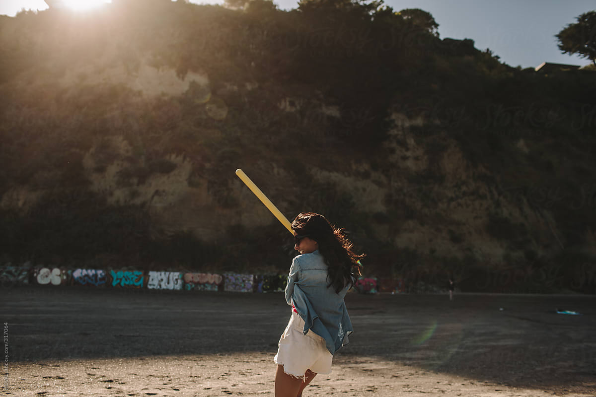 Summer fun playing baseball on the beach in California