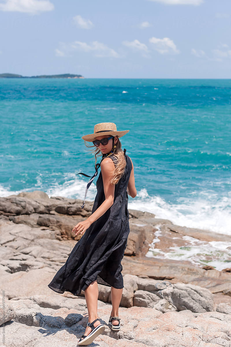 Stylish woman fashion dress hat tropic island vacation