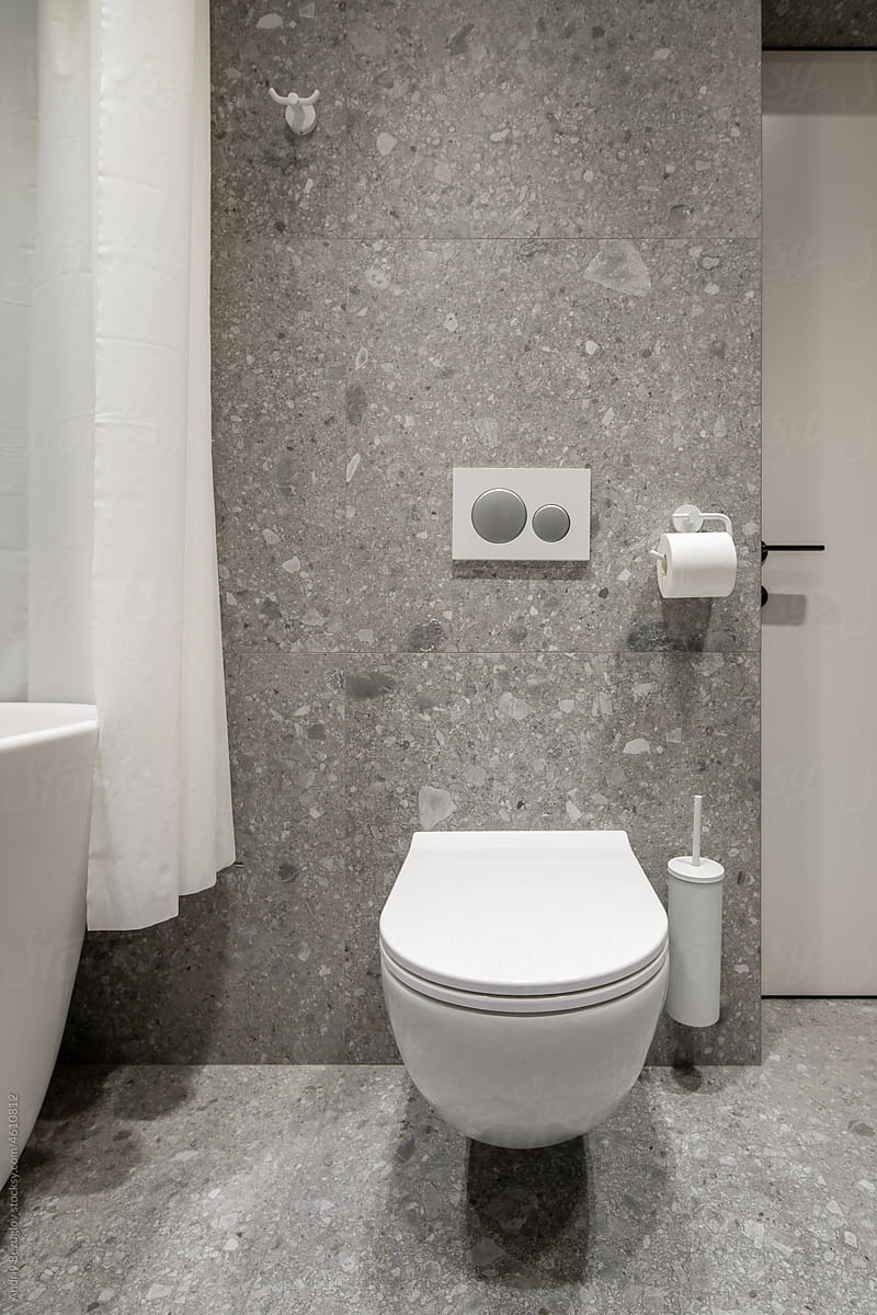 Bathroom in contemporary style with tiled walls