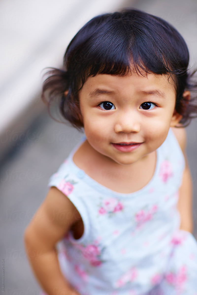 lovely little asian girl portrait by Bo Bo for Stocksy United.